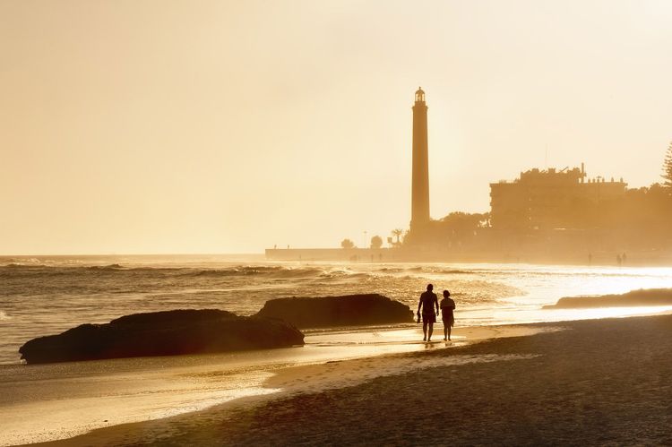  Maspalomas beach and lighthouse at sunset © Valery Bareta/Shutterstock